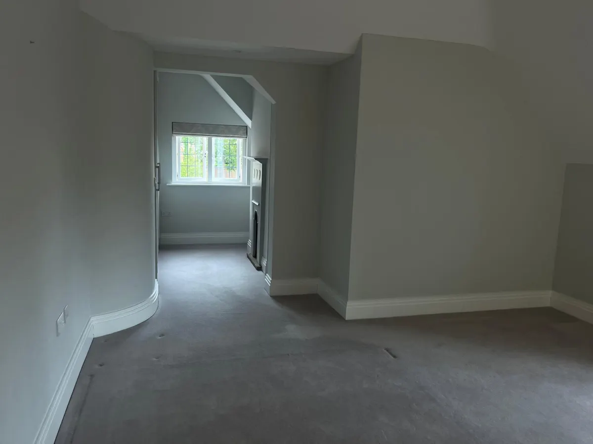 Empty carpeted bedroom ready for handover